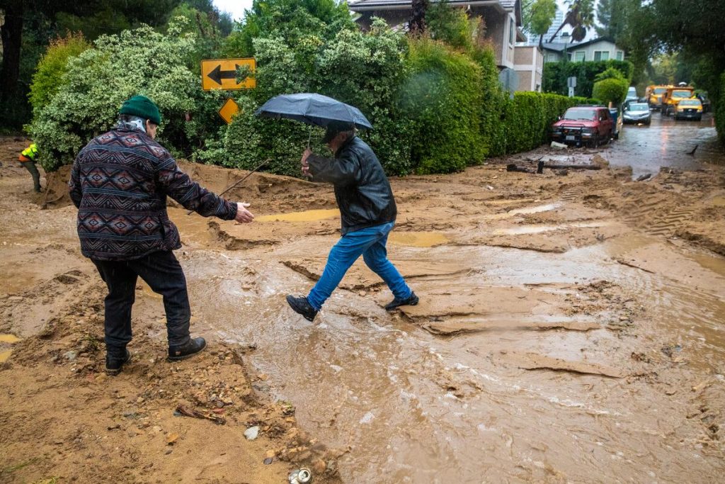 Hillside runoff and sediment-laden floodwater reaching a residential foundation in Rancho Cucamonga CA during an atmospheric river storm event