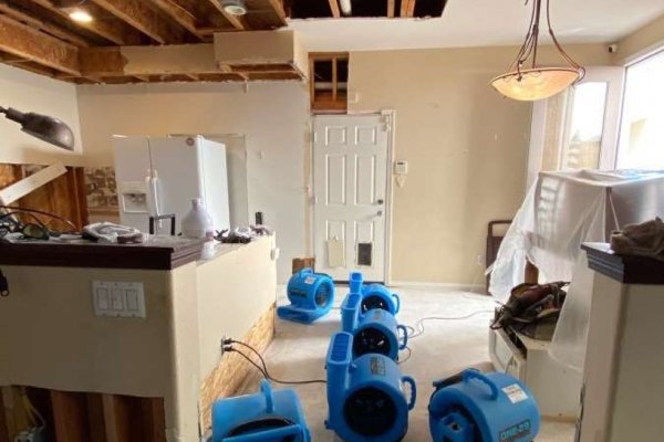 Technician assessing damage in a Rancho Cucamonga home