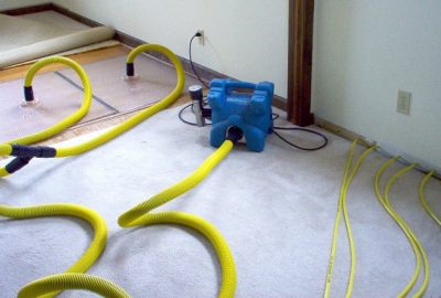 water mitigation crew extracting water from home