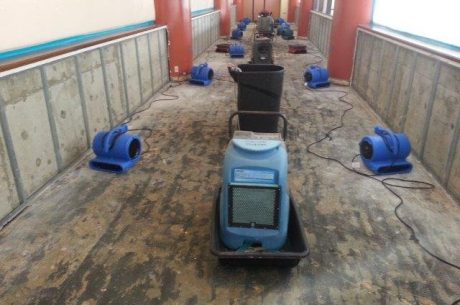 water damage clean up crew working inside home Ontario California