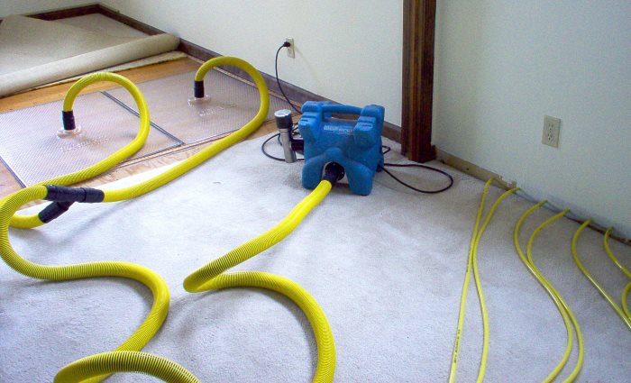 water mitigation crew extracting water from home