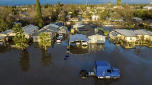 Homeowner discovering water damage after returning to their Rancho Cucamonga CA home following a summer vacation requiring immediate water damage restoration service