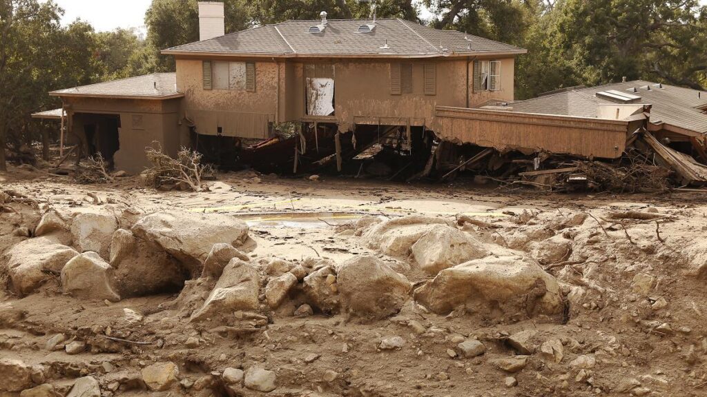 Hillside foothill property in Rancho Cucamonga CA experiencing debris flow and water intrusion during a heavy rain event requiring emergency water restoration response