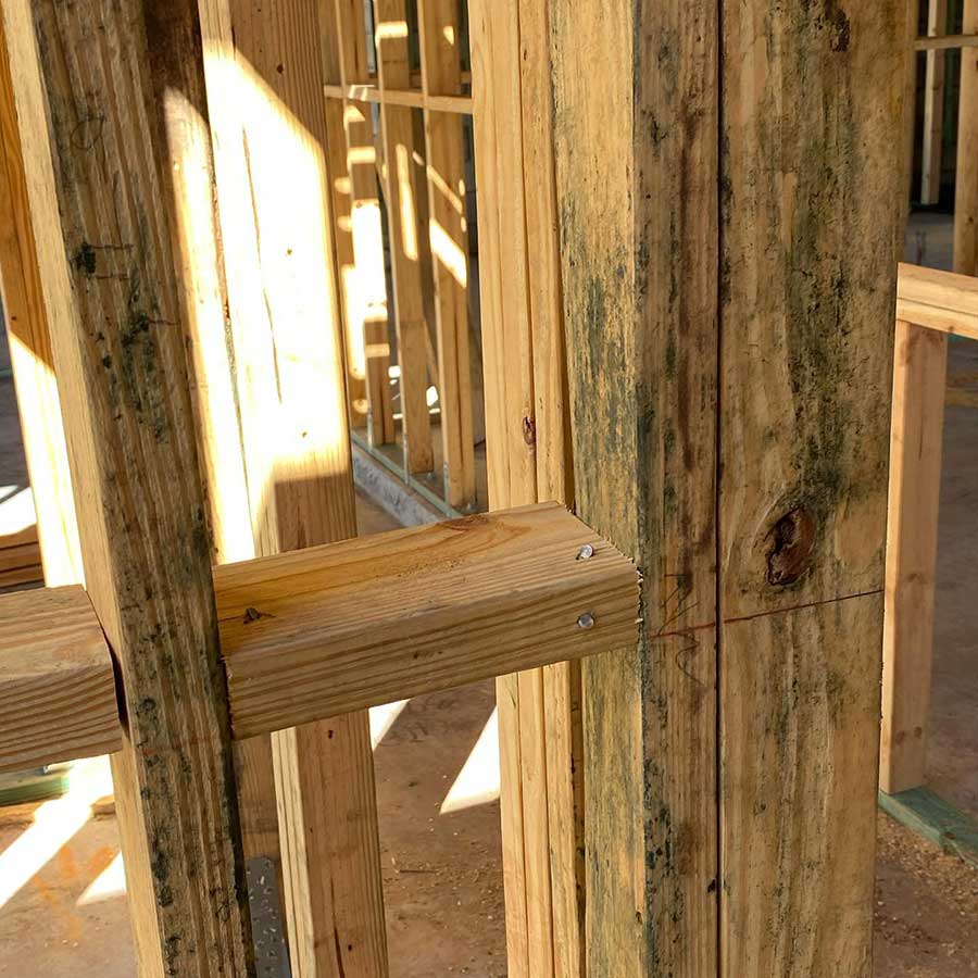 New construction framing with trapped construction moisture creating mold risk in a post-wildfire rebuild home in Rancho Cucamonga CA requiring professional mold removal