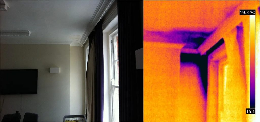 Moisture detection camera scanning a water-stained ceiling