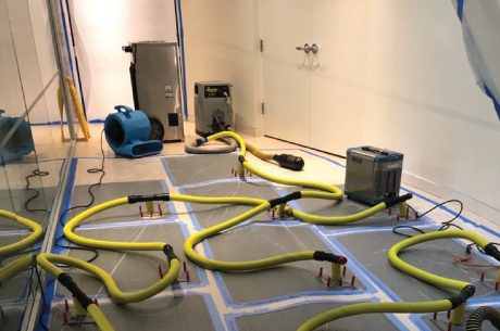 water restoration technicians working inside residential home Ridgewood New Jersey