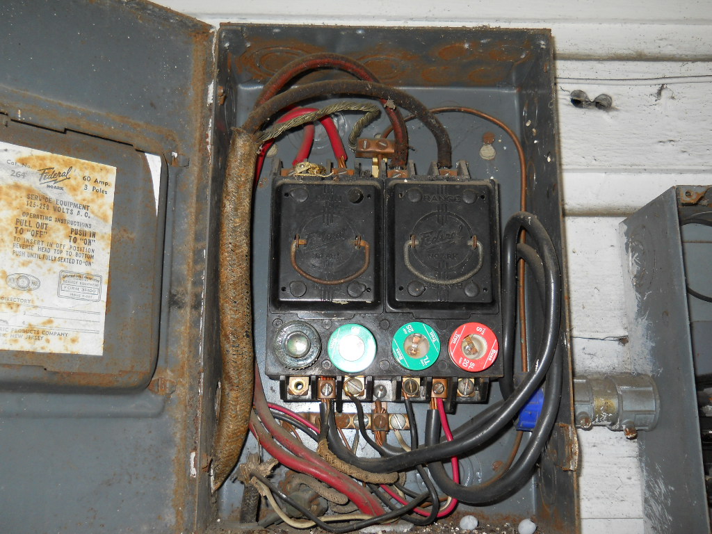 Outdated electrical panel in an older Bergen County NJ home representing fire damage risk and complication for post-fire restoration assessment