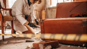 Professional crime scene cleanup specialist inspecting an indoor area in San Clemente after a traumatic incident