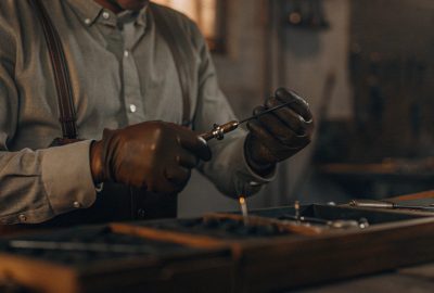 Fire restoration expert repairing a fire-damaged electronic component during the contents restoration process.