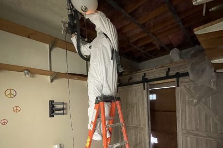 One of our technicians repairing the damage the garage sustained.