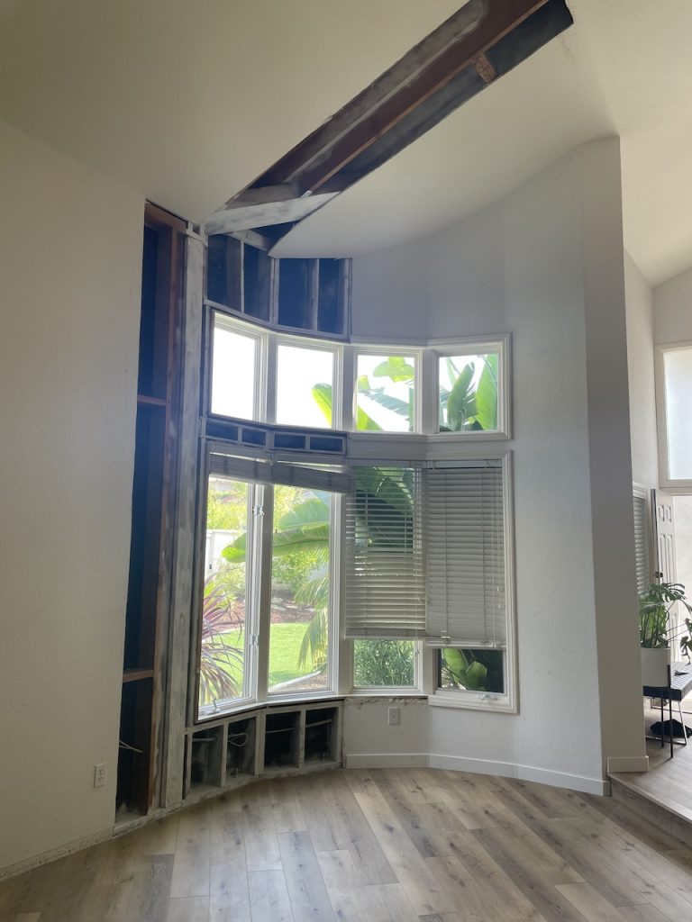 The damage caused by the category two roof leak.