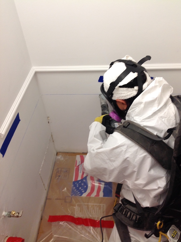 Technician on site of a category 3 water loss job