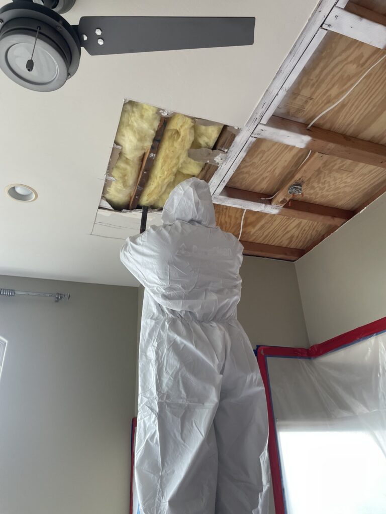 One of our PuroClean technicians investigating this home's roof water leak.