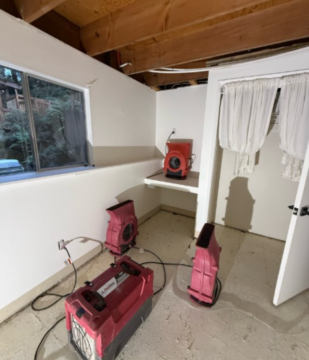 how to fix warped wood floor from water ; professional restoration air mover placement