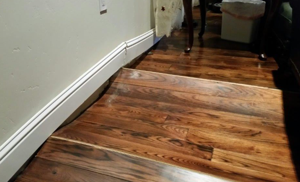 warped flooring sign of hidden water damage home Montgomery County