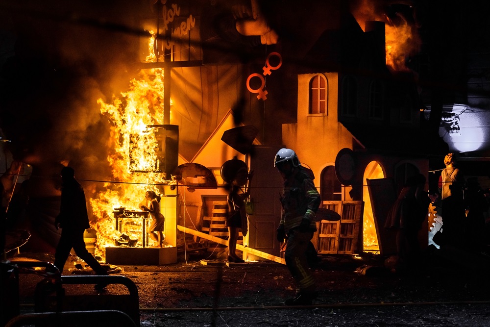 firemen around a bonfire caused by a falla valenci 2023 11 27 05 01 19 utc