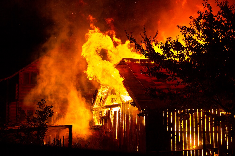 wooden house or barn burning on fire at night 2023 11 27 05 33 02 utc