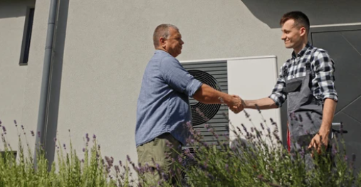 A satisfied homeowner shaking hands with a PuroClean technician outside a freshly restored home; both smiling, daylight setting, suburban Pennsylvania neighborhood backdrop | Insurance Claim Restoration in Abington