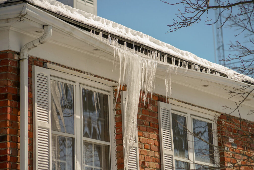 icicle on the house roof in winter season