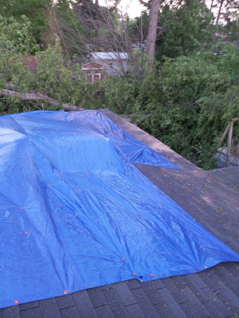 The tarp is used to protect the home from water damage.
