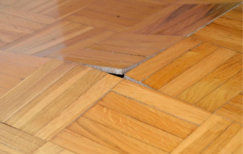 Buckled hardwood floors caused by water damage