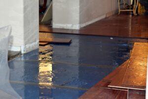 water damage on floor with flooring removed