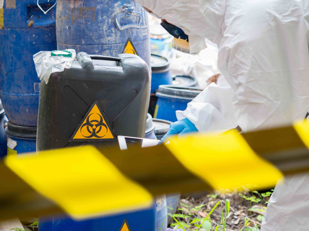 Biohazard cleanup worker handling hazardous waste