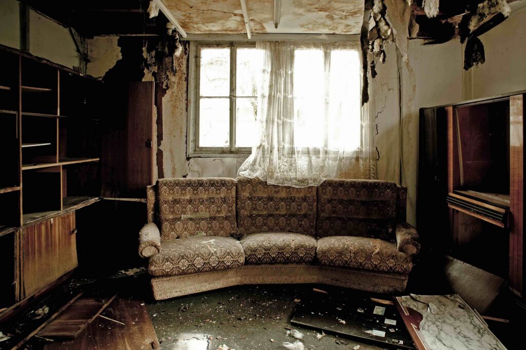 Smoke and fire damaged living room interior