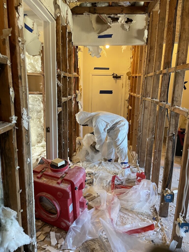 Our technician removing affected materials and drying the structure.