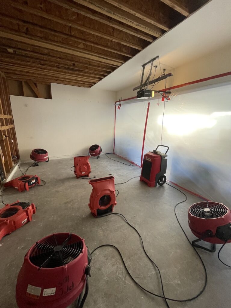 Our equipment drying the damage caused by the sink supply line leak.