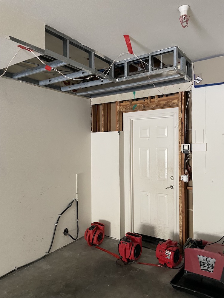 A look at the garage door affected by the category two water loss.