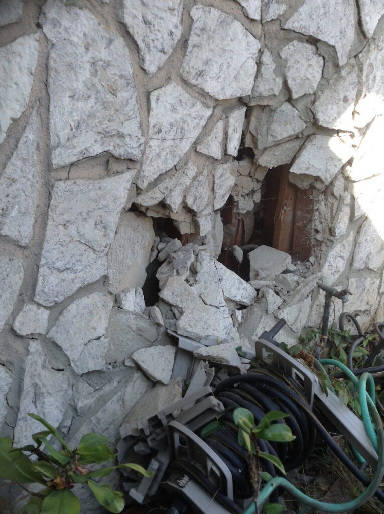 Source of water supply line burst. Outside of home damaged by car who crashed into side.