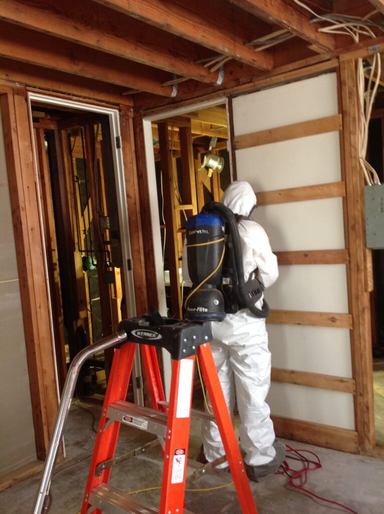 One of our technicians handling the patio drain leak.