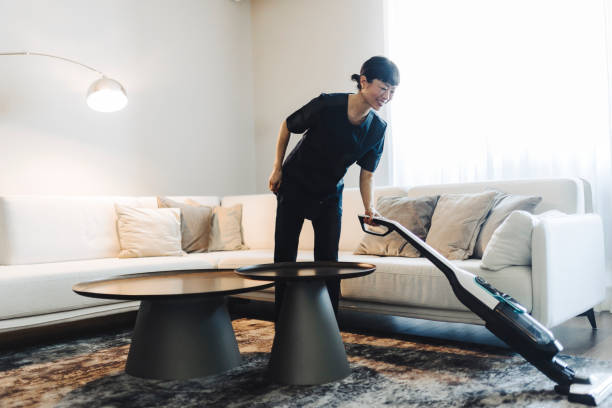 Carpet cleaning services Mount Vernon technician steam cleaning living room carpet