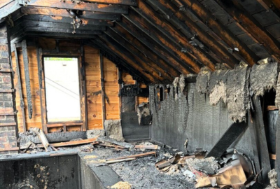Professional emergency fire damage cleanup services restoring residential property after a fire.