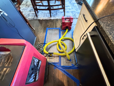 Drying equipment in place as part of a home water damage restoration process, helping remove excess moisture and support proper drying inside a residential space.