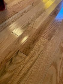 The hardwood floors experienced water damage.