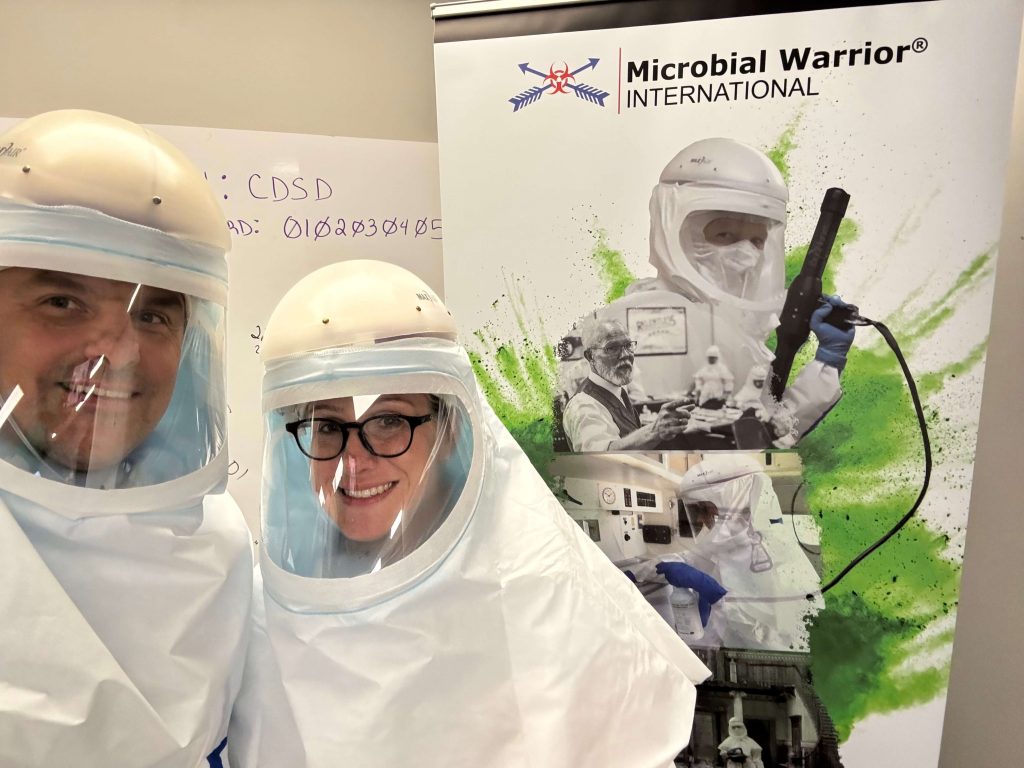  Certified cleanup professionals in full protective gear performing advanced tear gas decontamination—representing physician-led trauma cleanup in Northeast Tucson.