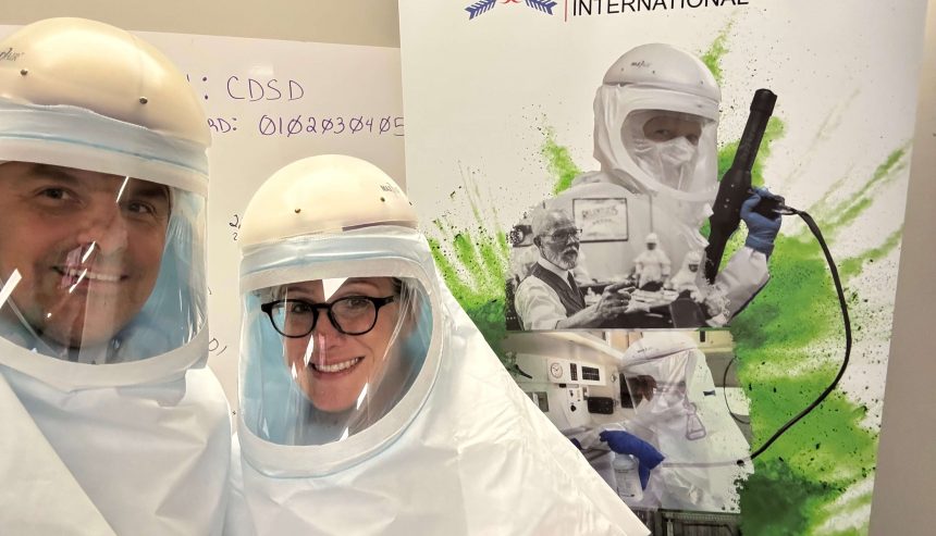 Two certified technicians in full protective suits at a biohazard and hoarding cleanup training session, representing professional cleanup services in Northeast Tucson.