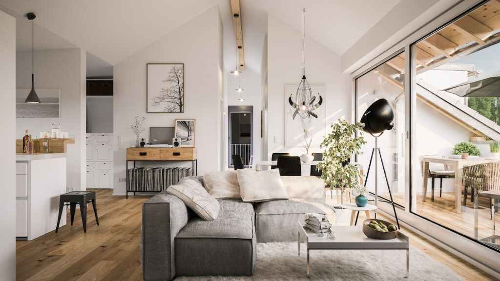 Modern living room with a gray sectional sofa, wooden floors, large windows, and stylish decor elements.