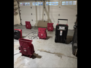Drying equipment in place as part of a home water damage restoration process, helping remove excess moisture and support proper drying inside a residential space.