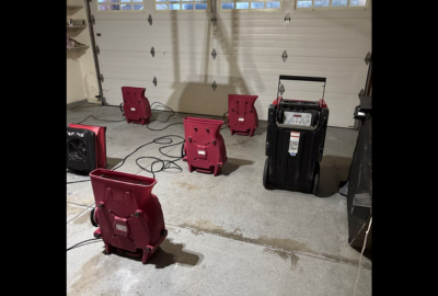 Drying equipment in place as part of a home water damage restoration process, helping remove excess moisture and support proper drying inside a residential space.