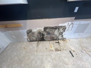 Mold behind kitchen sink