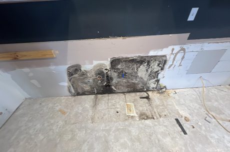 Mold behind kitchen sink