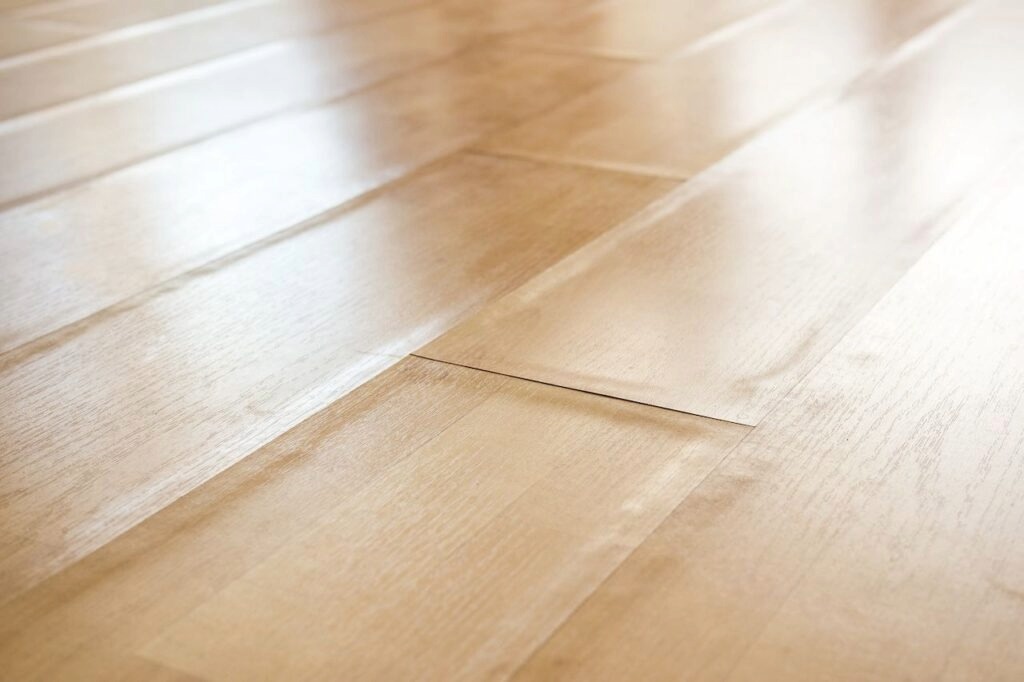 Laminate floor showing a raised area or bubble at a