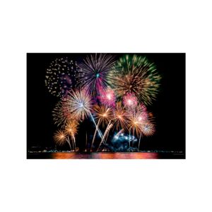 A spectacular display of colorful fireworks illuminates the night sky above a reflective body of water. TITLE