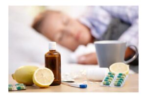 Cold and flu remedies, including medicine, lemons, and pills, are displayed in