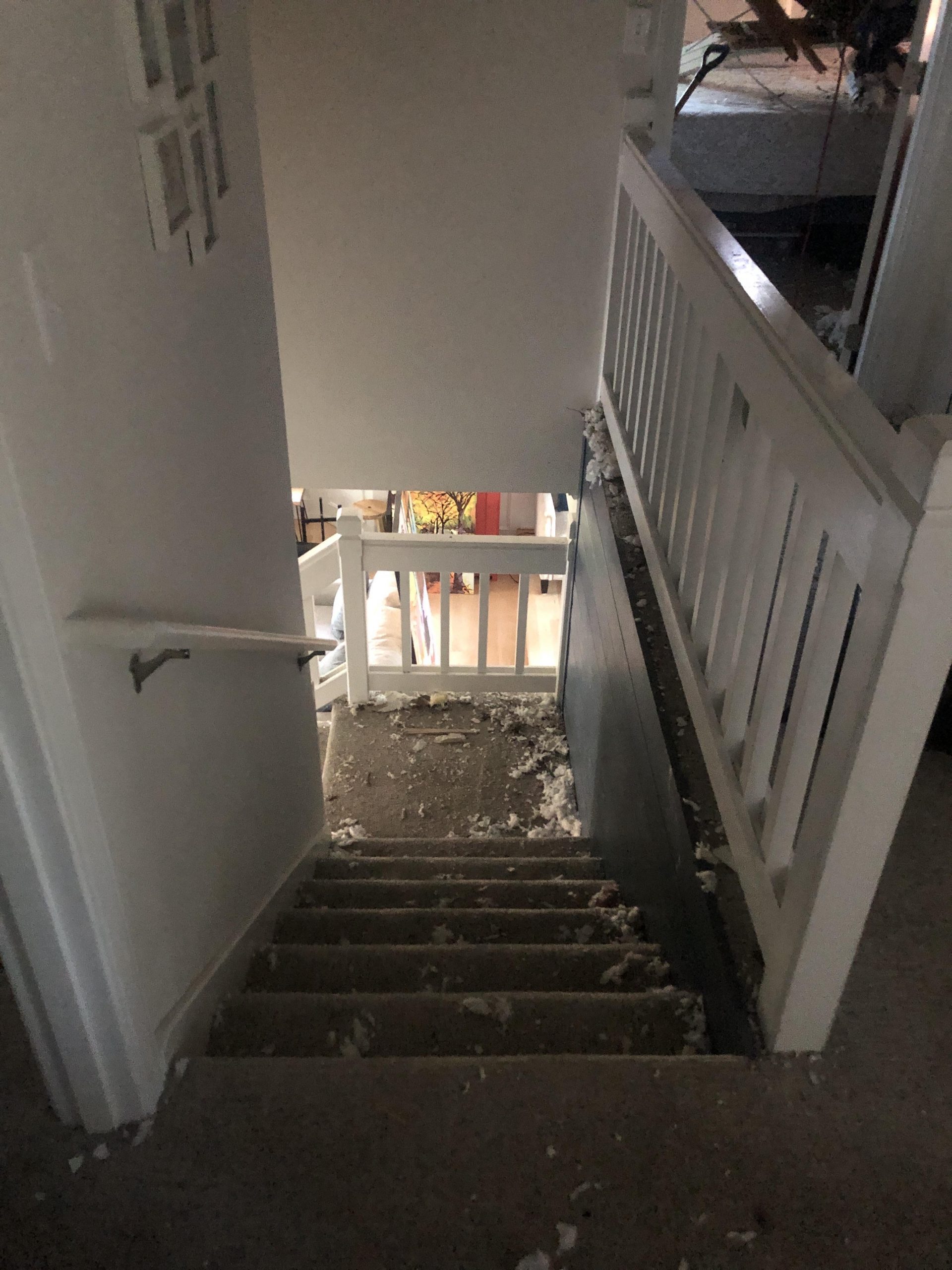 Water damage throughout staircase