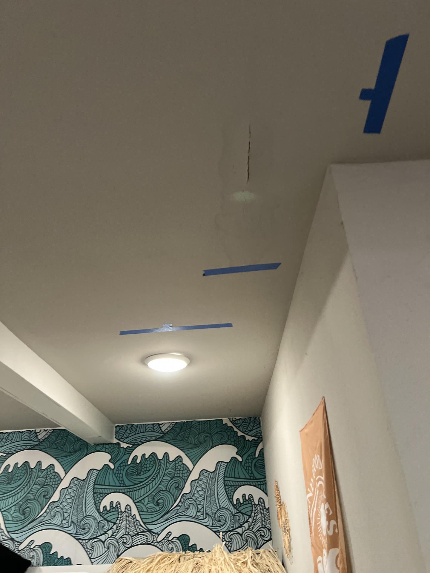 Ceiling crack from water intrusion damage