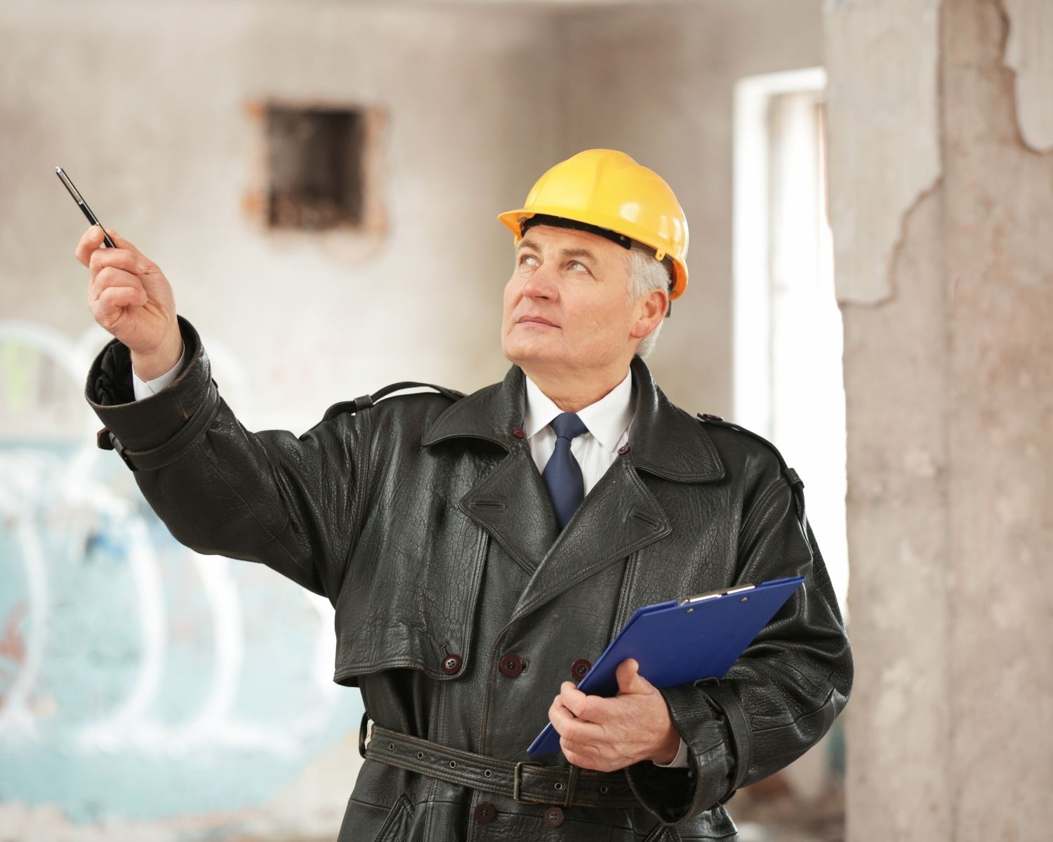 Insurance adjuster reviewing water damage documentation